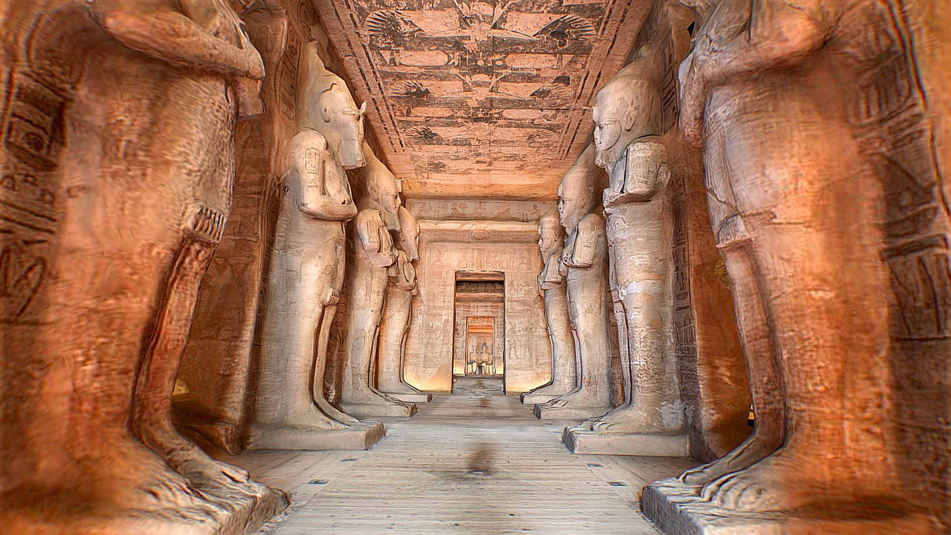 Giant Sandstone Statues Inside The Temple Of Abu Simbel Background