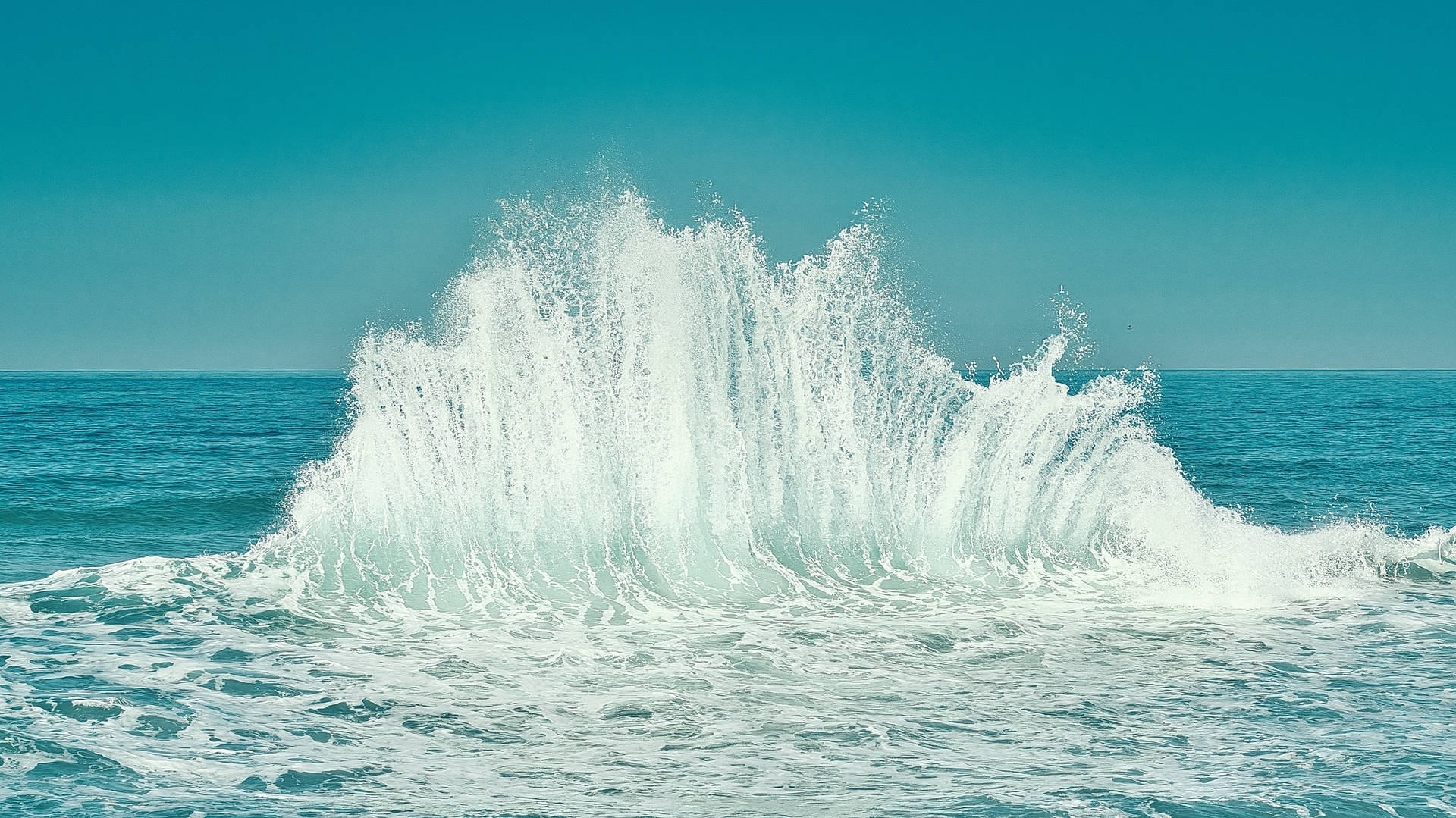 Giant Splash On Ocean Blue Waters Background