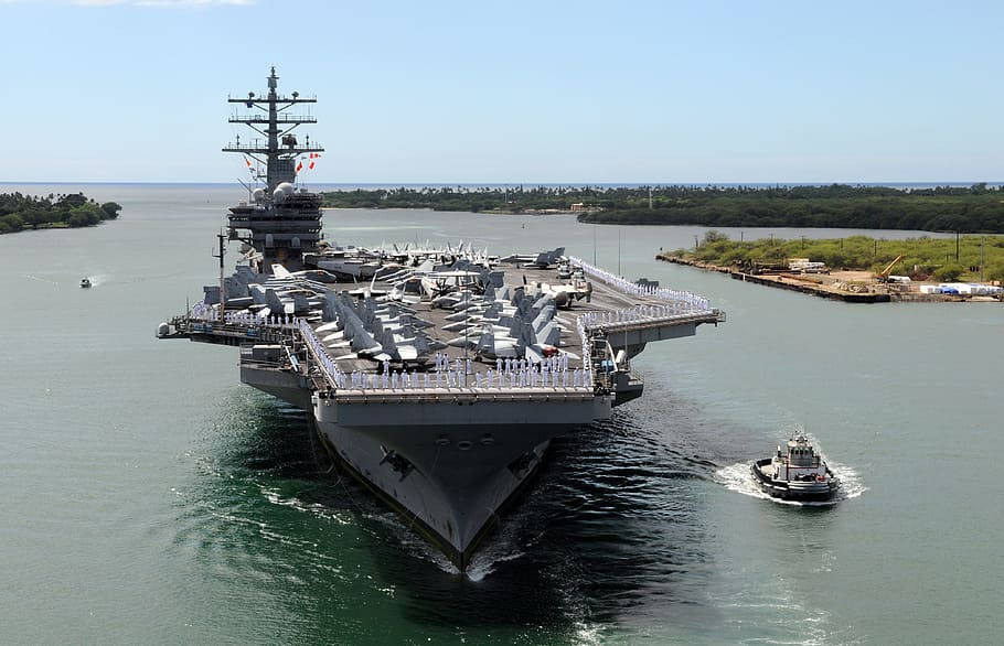 Gigantic Aircraft Carrier In Pearl Harbor Background