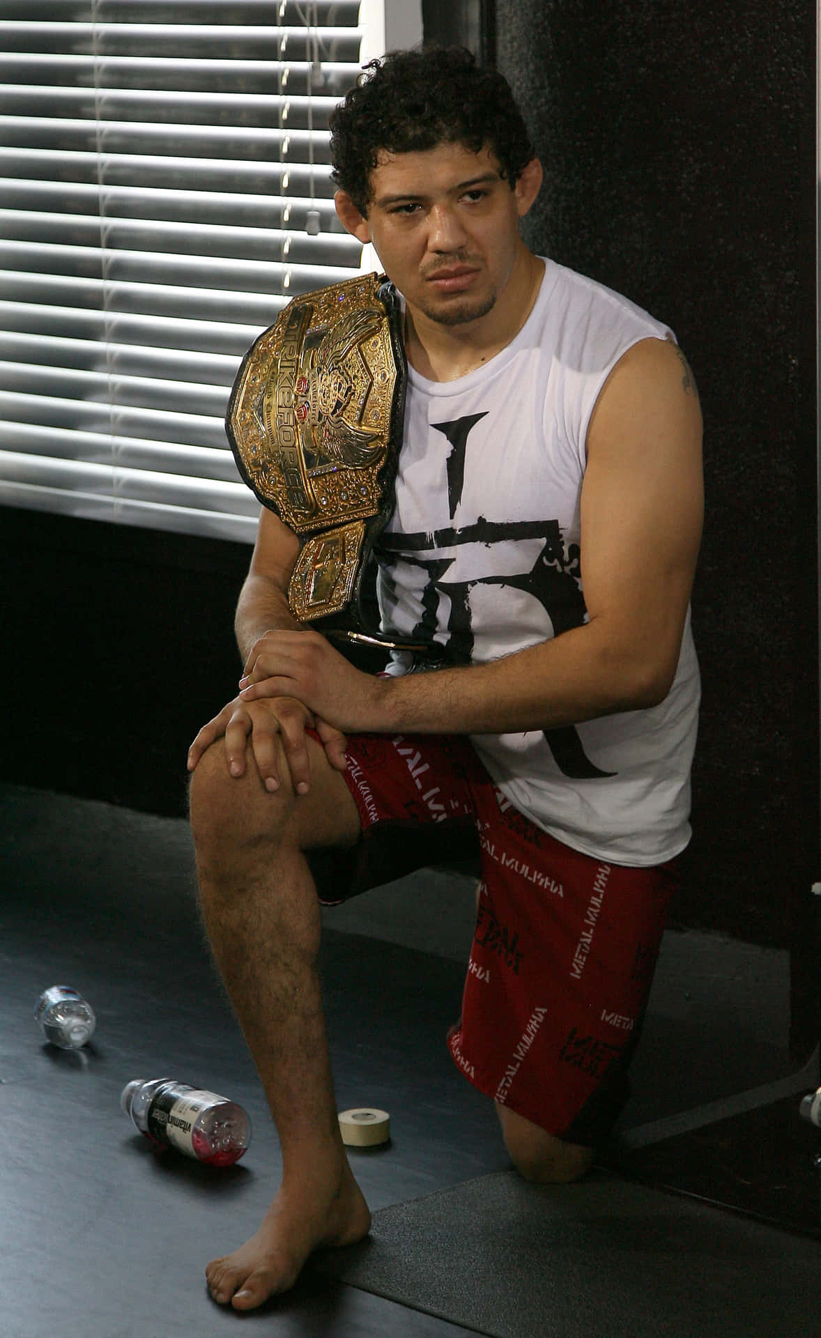 Gilbert Melendez Strikeforce Lightweight Champion Kneel Background