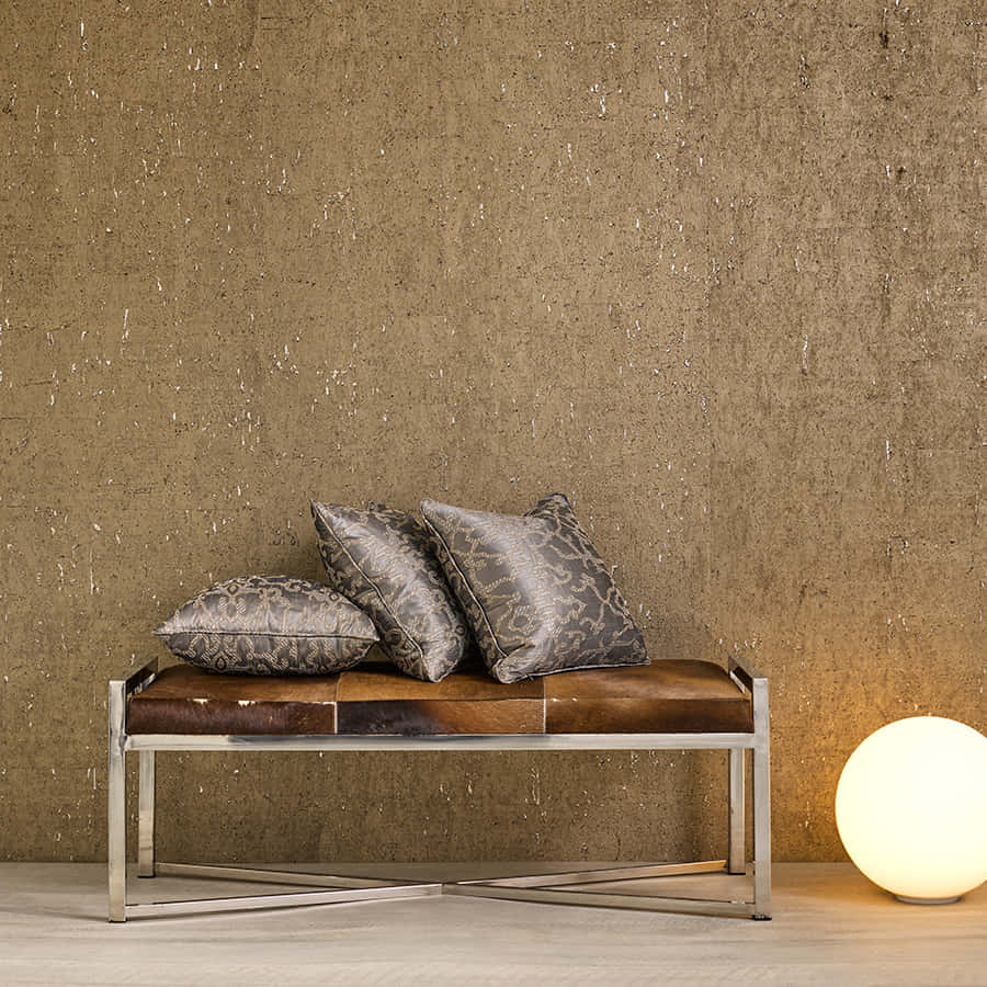 Gilded Wall Details With Chair And Pillows Background