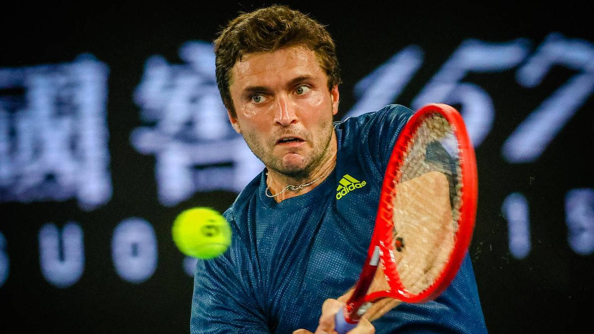 Gilles Simon And Tennis Ball Background