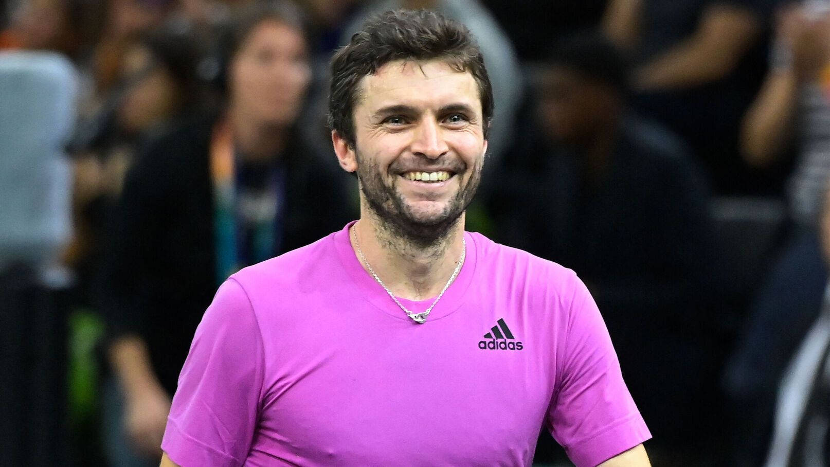 Gilles Simon Celebrating A Winning Shot In Tennis Match Background