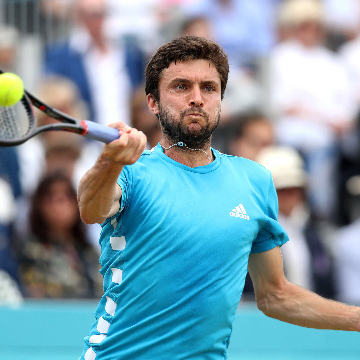 Gilles Simon In Action During A Professional Tennis Match.