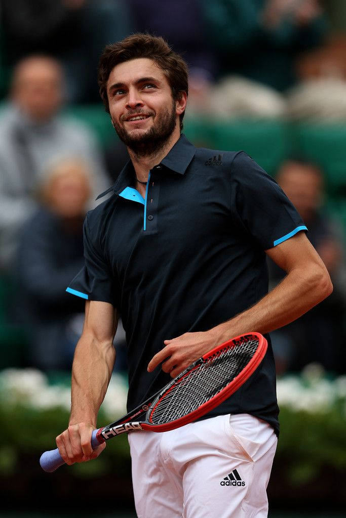 Gilles Simon Smiling During Match Background