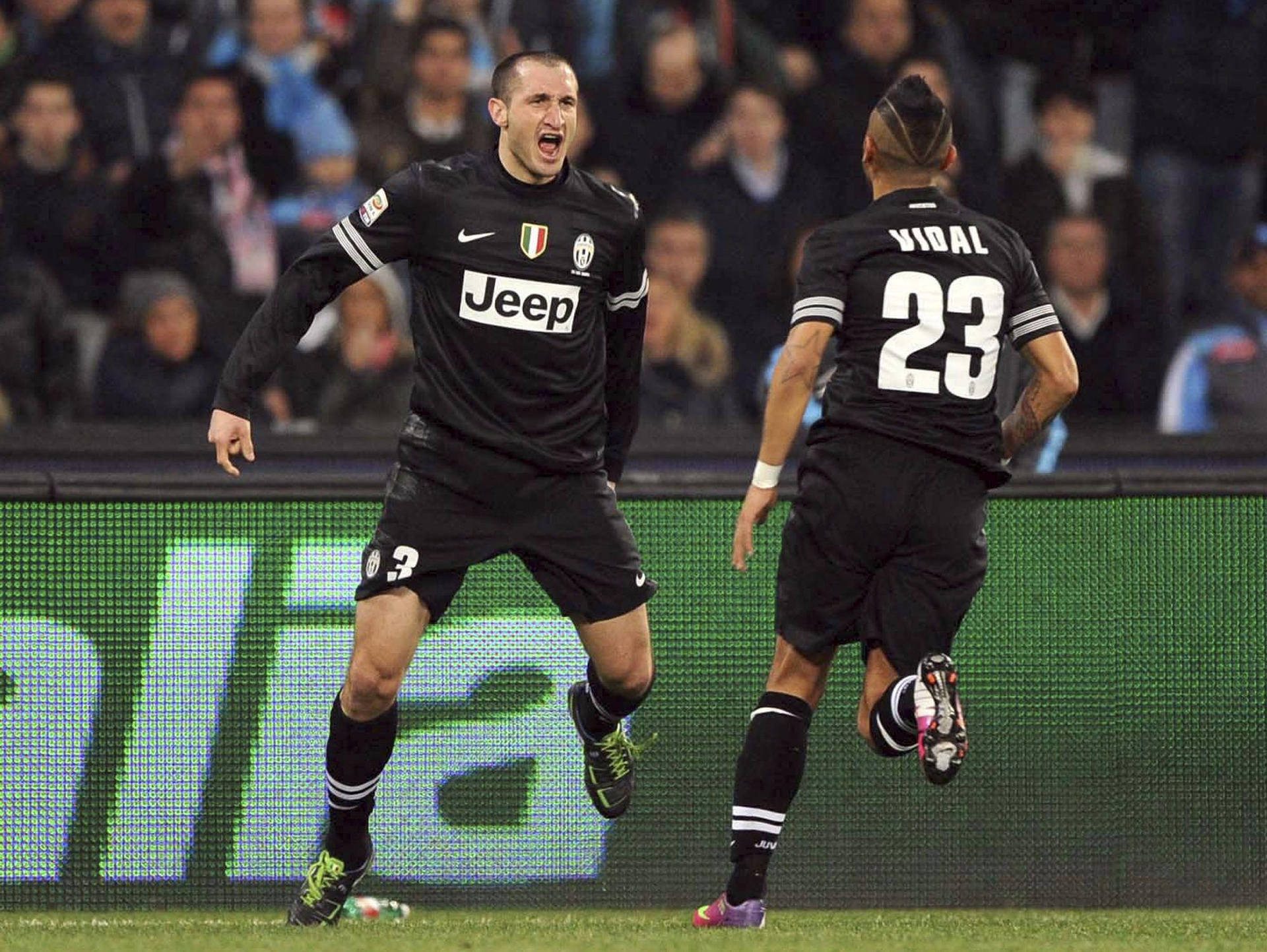 Giorgio Chiellini And Arturo Vidal Juventus Fc Background