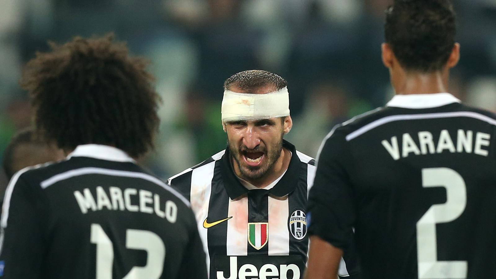 Giorgio Chiellini In Action Against Marcelo Vieira And Raphael Varane Background