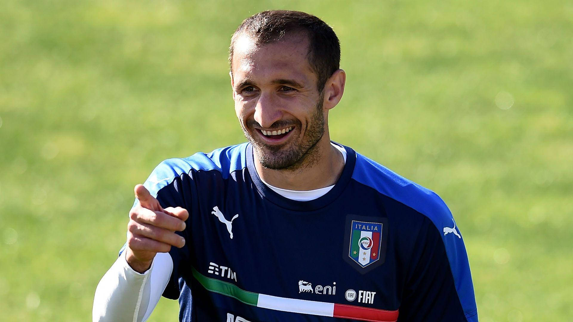 Giorgio Chiellini Italian Football Player Pointing Smile Background