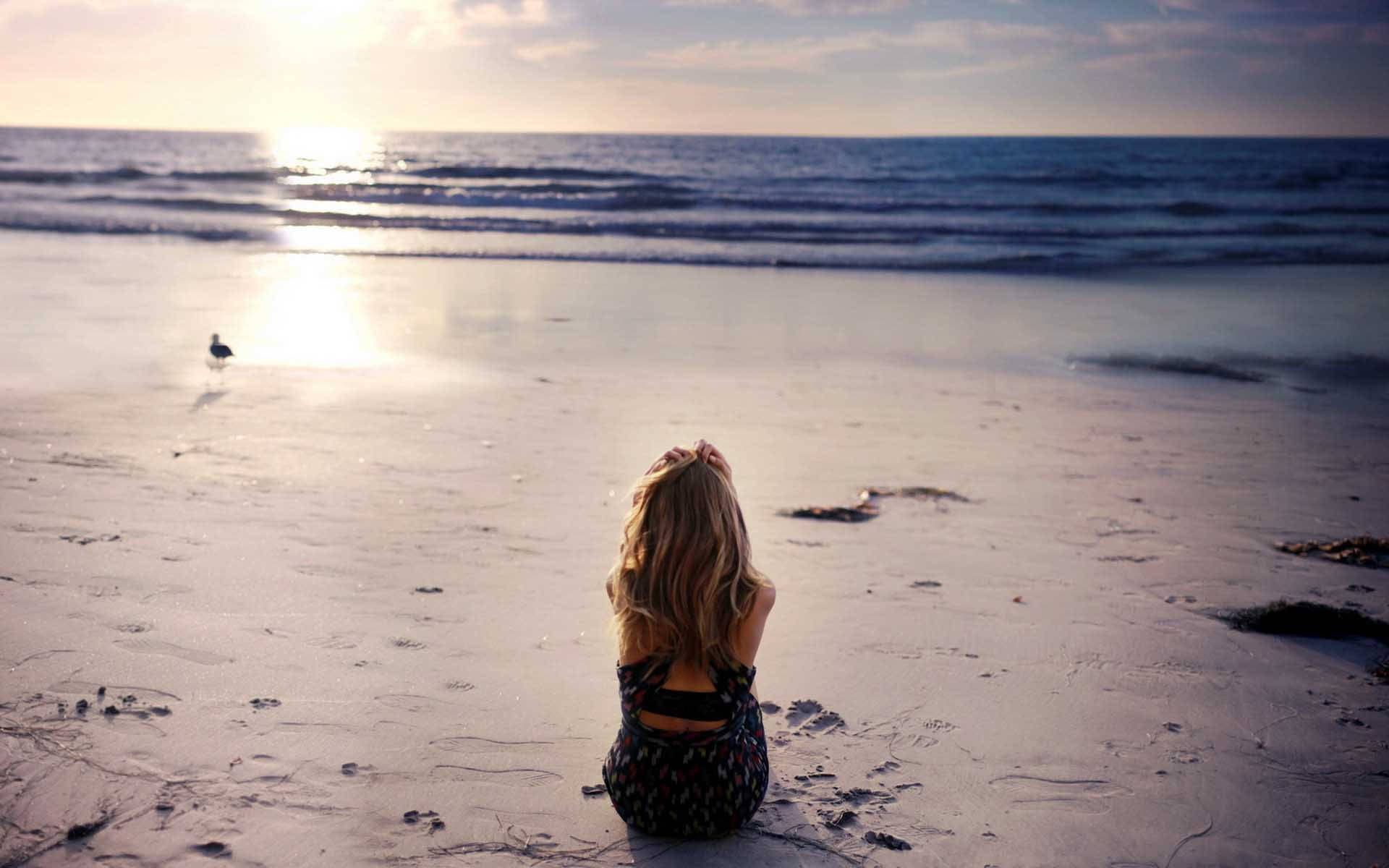 Girl Alone On The Beach