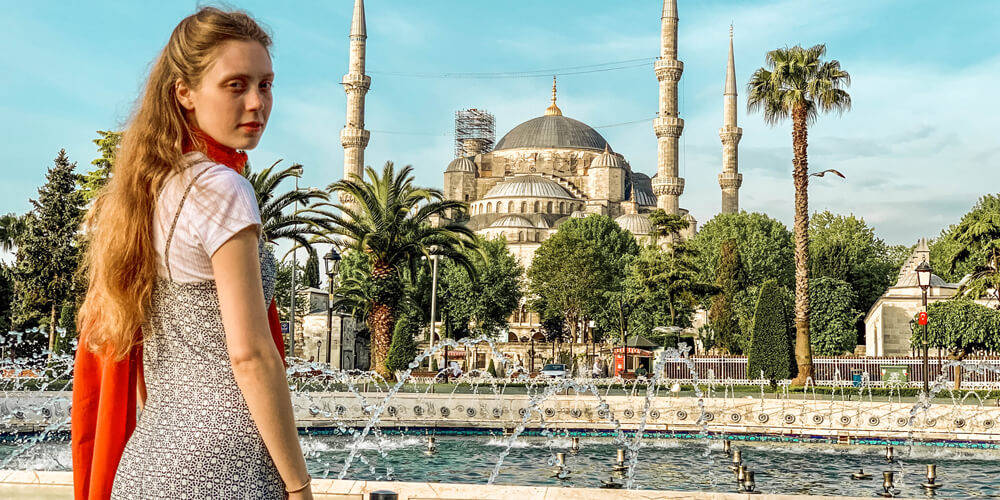 Girl At Istanbul's Blue Mosque Background