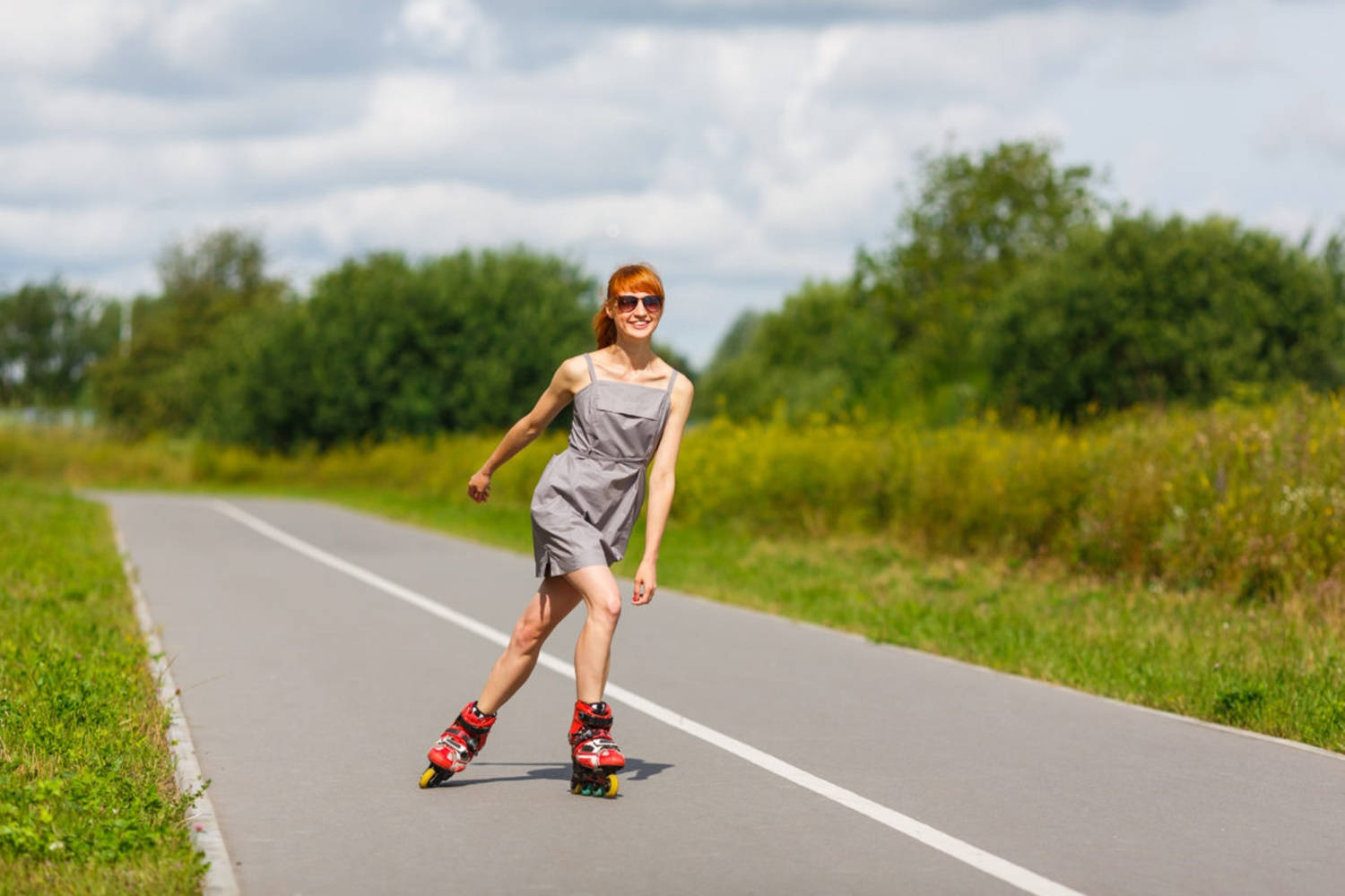 Girl Enjoys Rollerblading Country Road