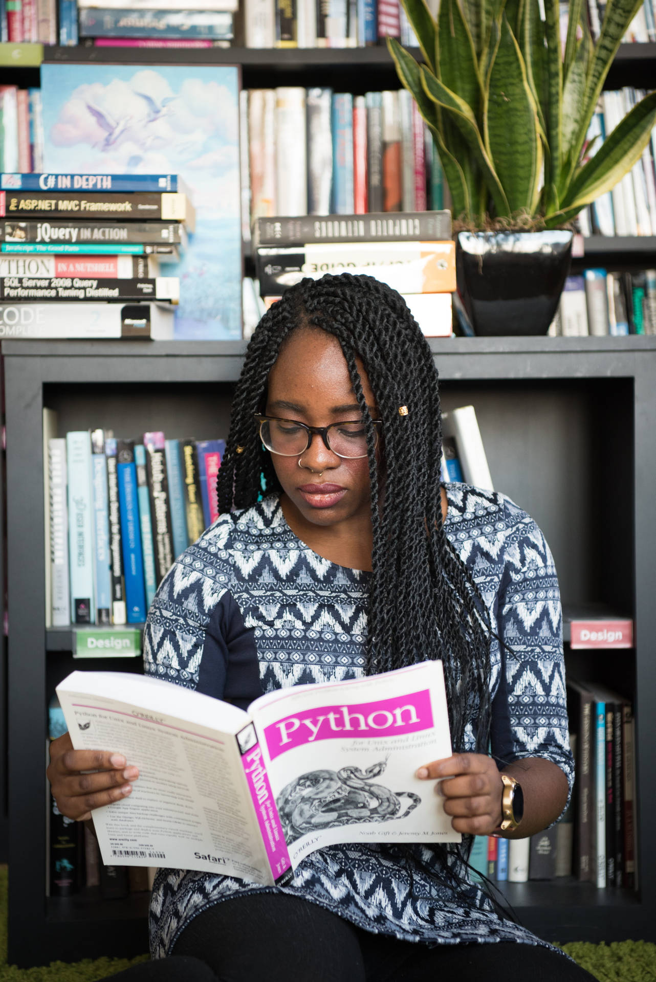 Girl Reading Reference Book For Coding Background