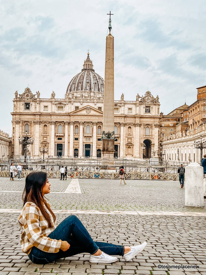 Girl Sitting In Vatican City Background