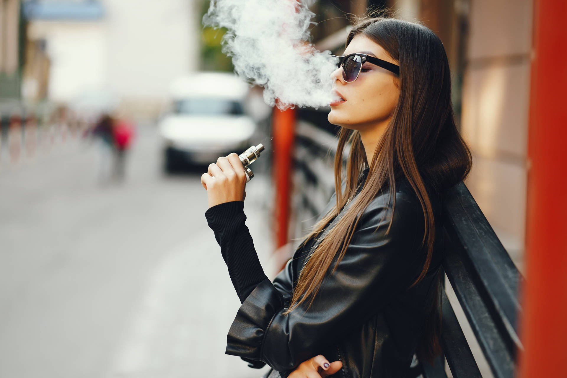 Girl Smoking In Street Background