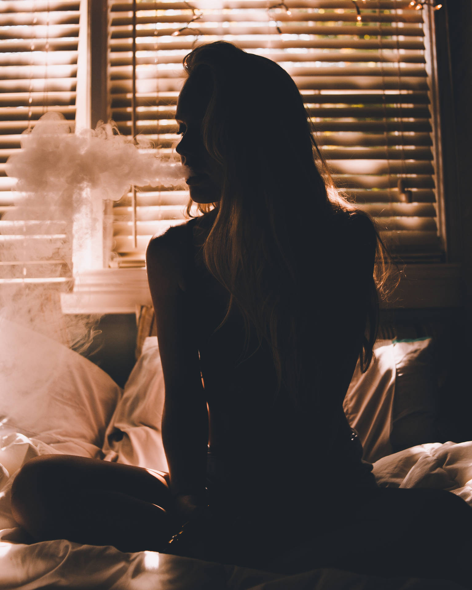 Girl Smoking On Bed Background