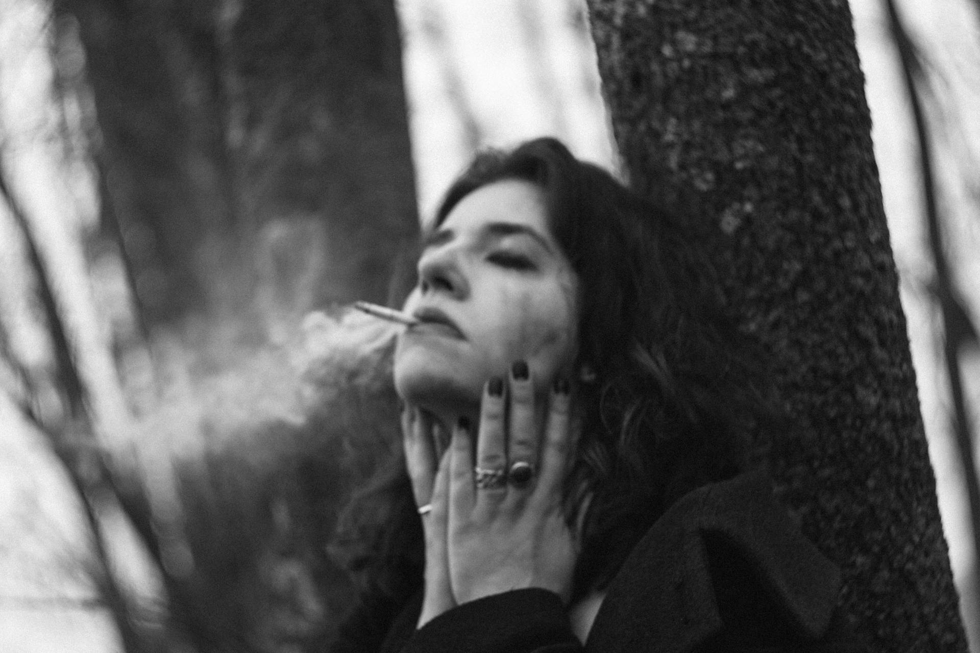Girl Smoking Under Tree Background