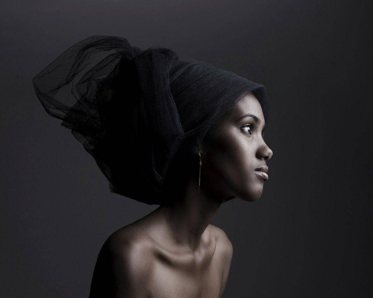 Girl With Black Headwrap Portrays Sexy Black Women Background