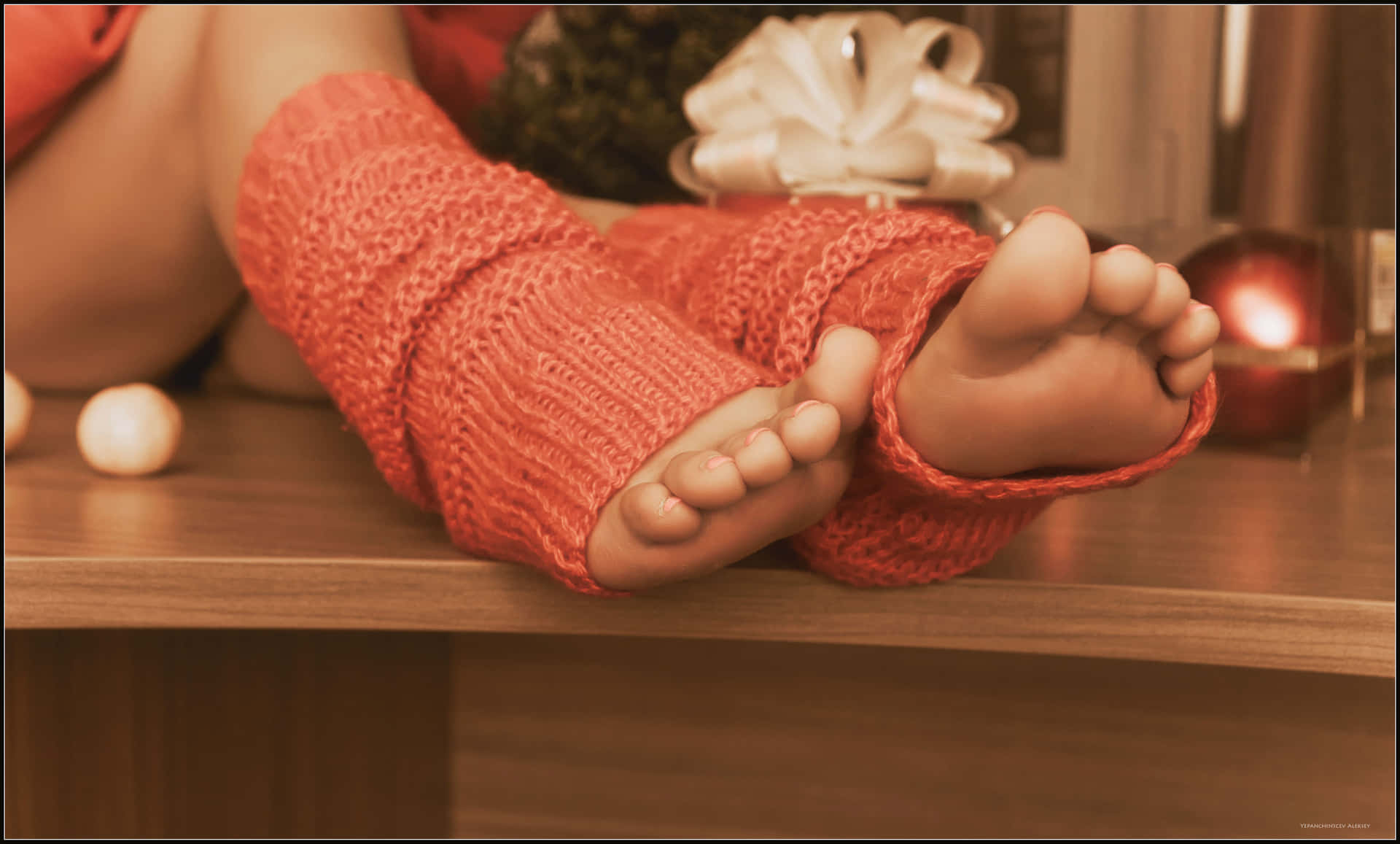 Girl’s Feet Dressed In Cozy Knitted Socks Background