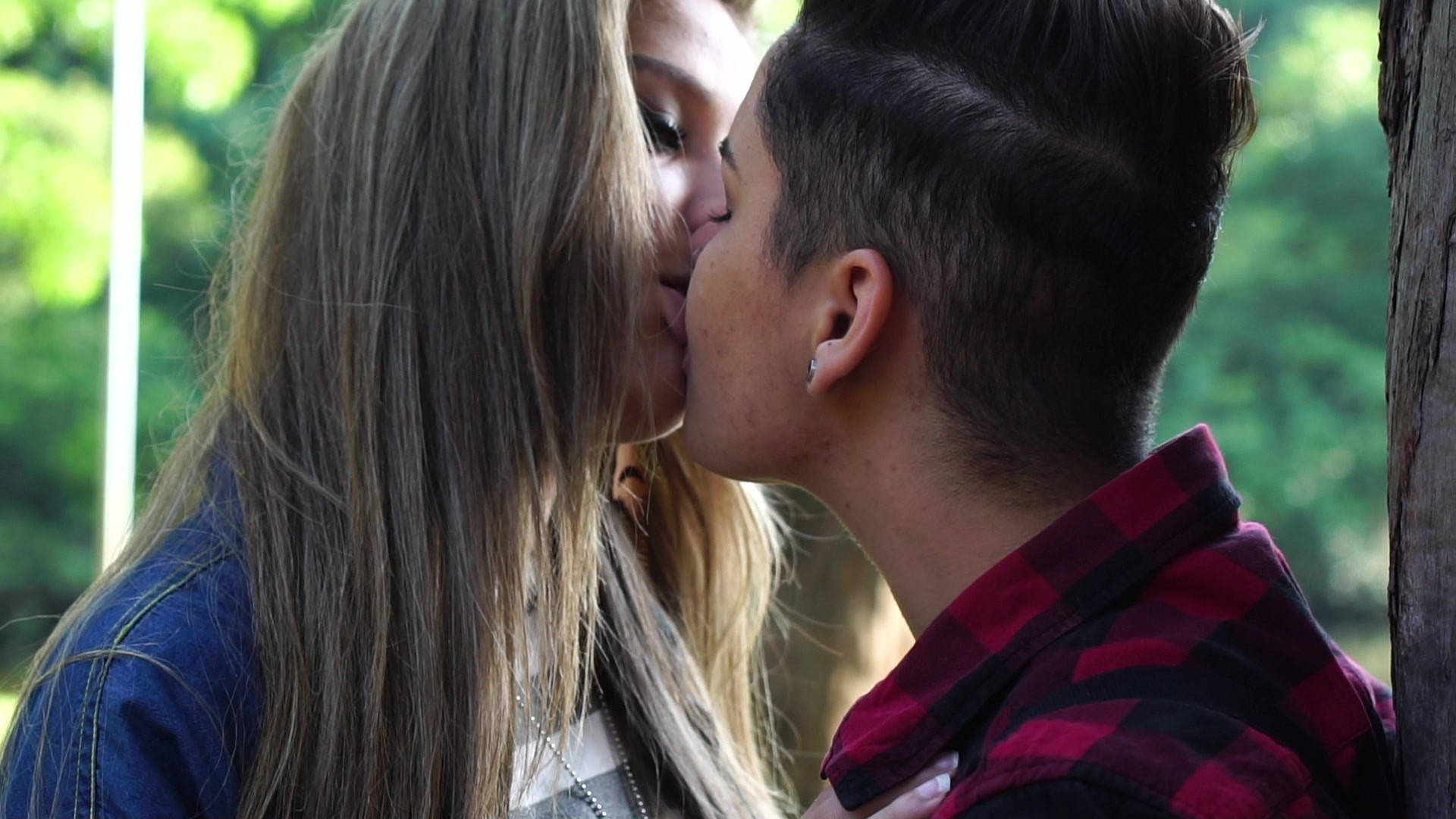 Girls Kissing At Park Background