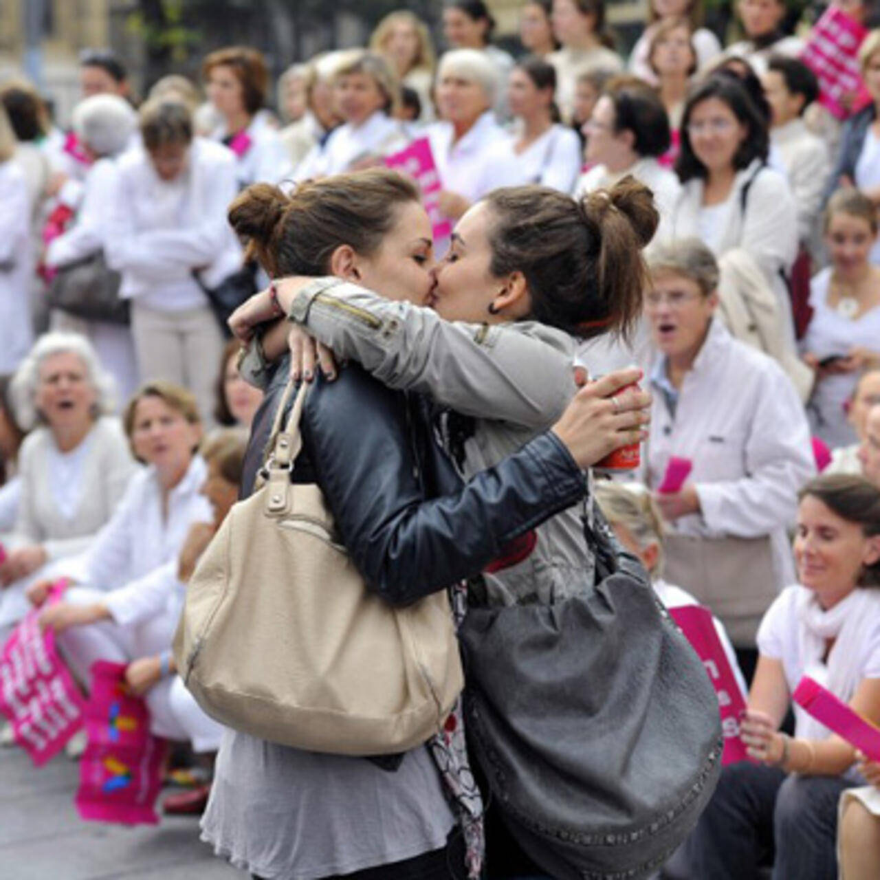 Girls Kissing At Protest Background