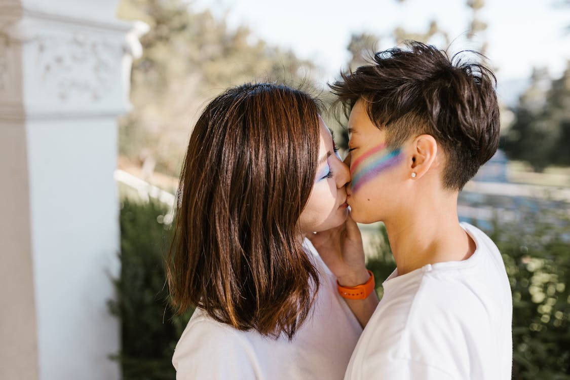 Girls Kissing With Rainbow Facepaint