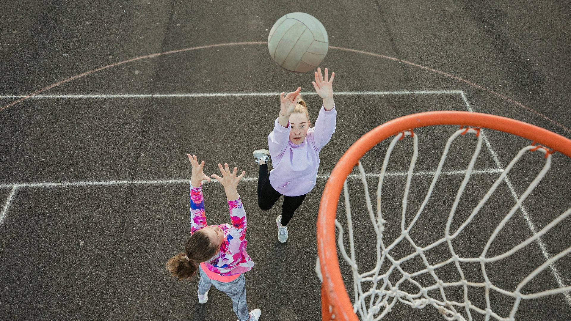 Girls Playing Netball Sports Court