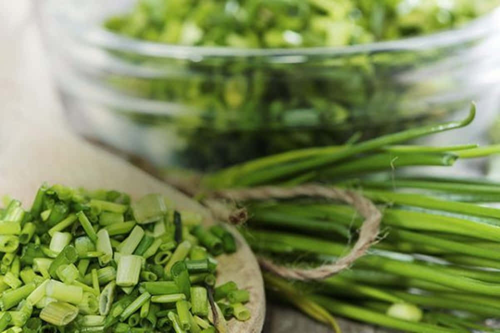 Glass Bowl Of Chopped Chives Background