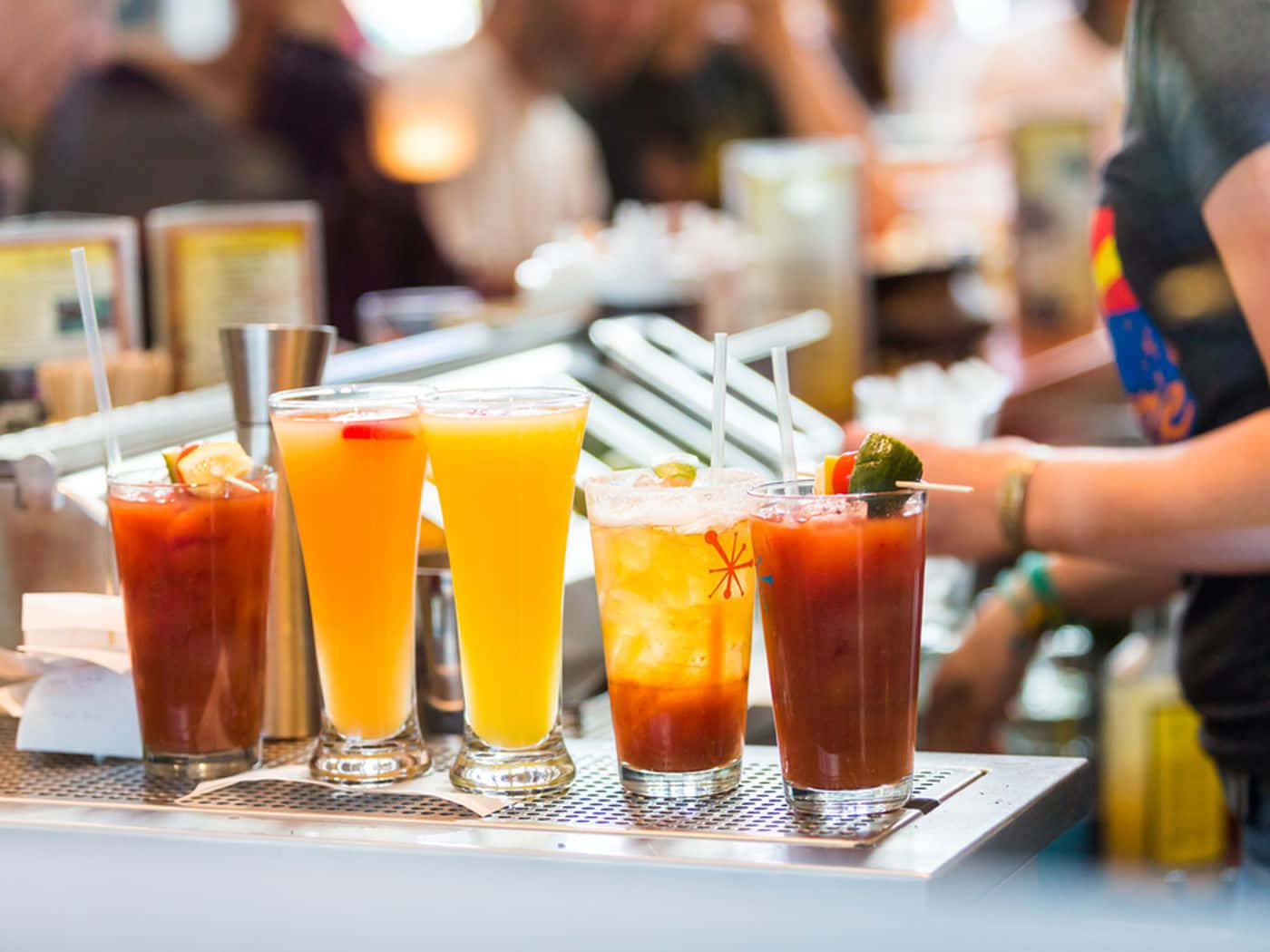 Glasses Of Cocktail Drinks On Metal Counter