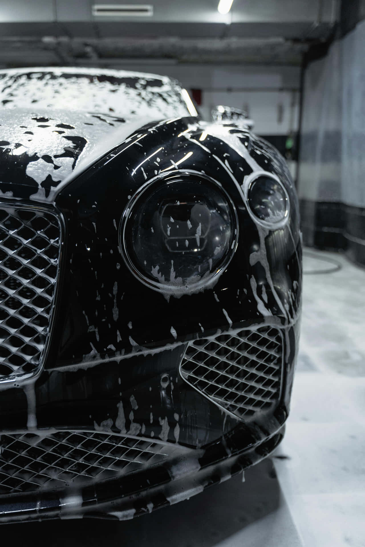 Gleaming_ Black_ Luxury_ Car_ Foam_ Wash.jpg Background