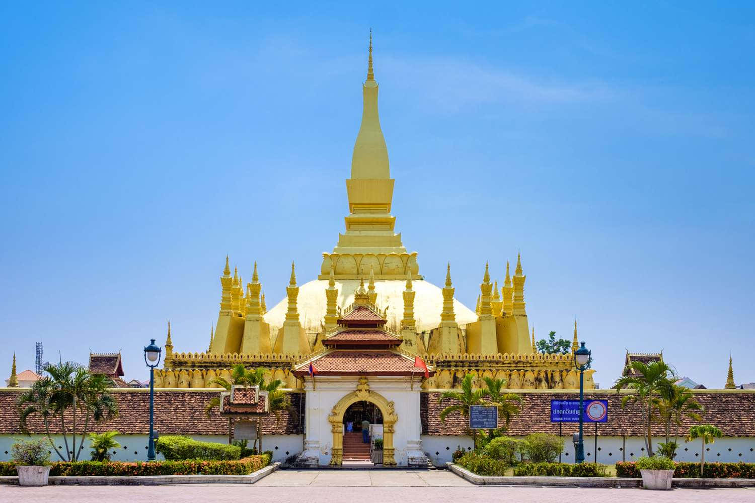 Gleaming Pha That Luang In Vientiane Background