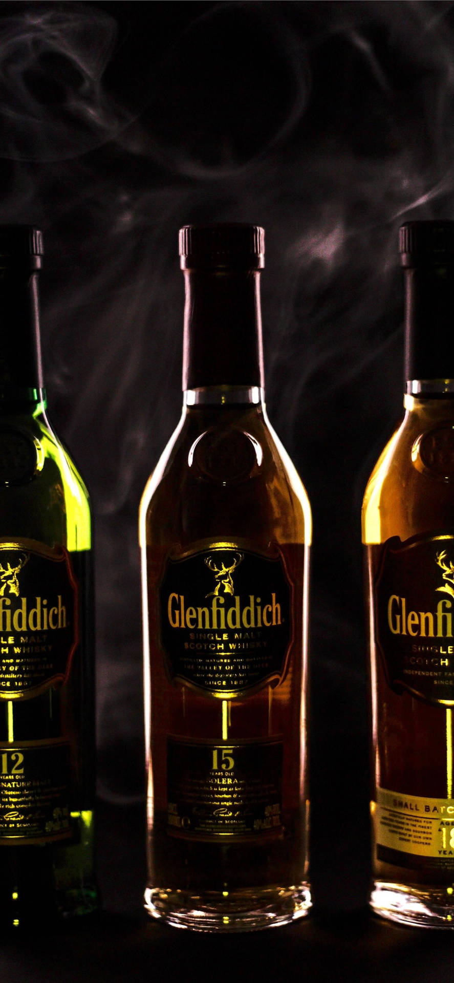 Glenfiddich Whiskies In Dim Lighting Background