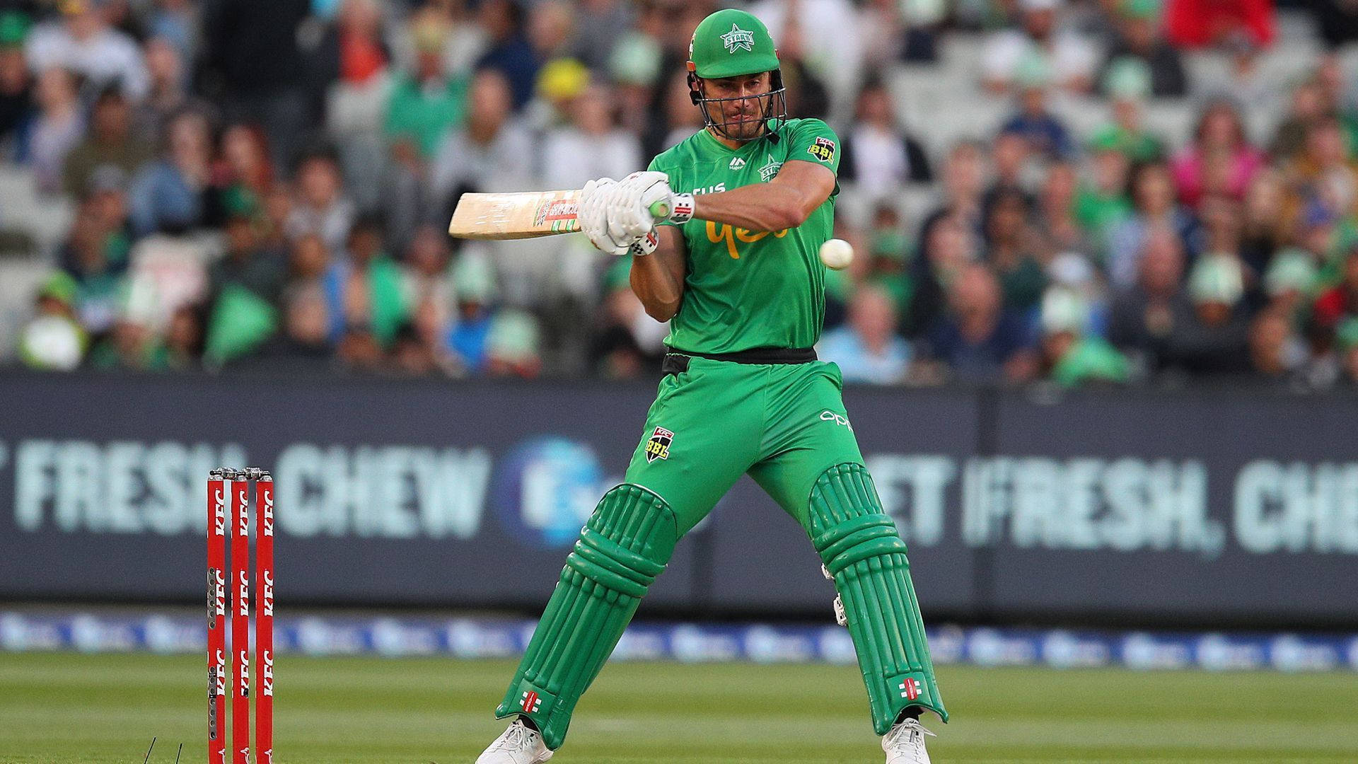 Glenn Maxwell In All-green Cricket Uniform Background