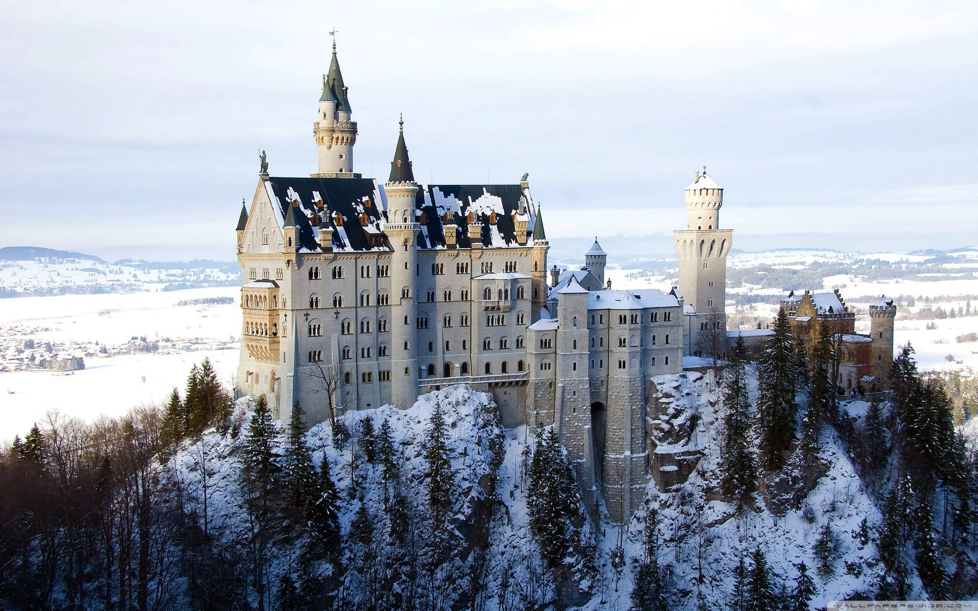 Glistening Neuschwanstein Castle During Winter Background