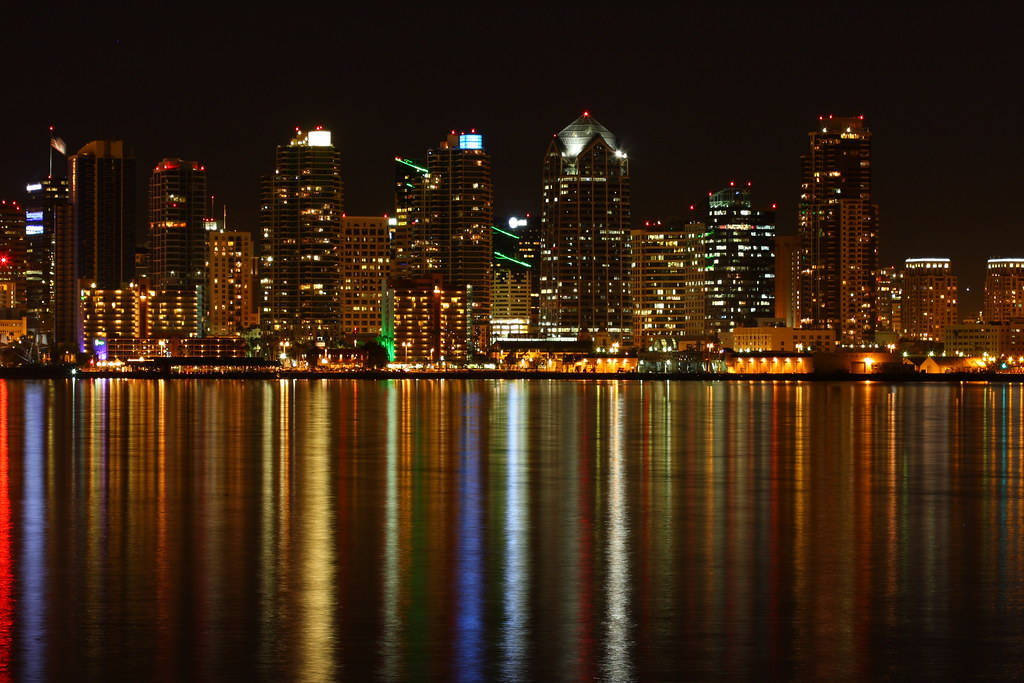 Glistening Waters Under San Diego Urbanscape Background