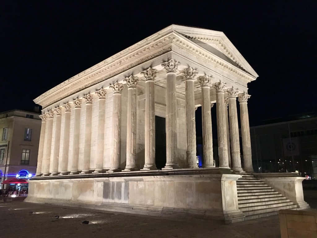 Glorious Maison Carrée In The Evening Background