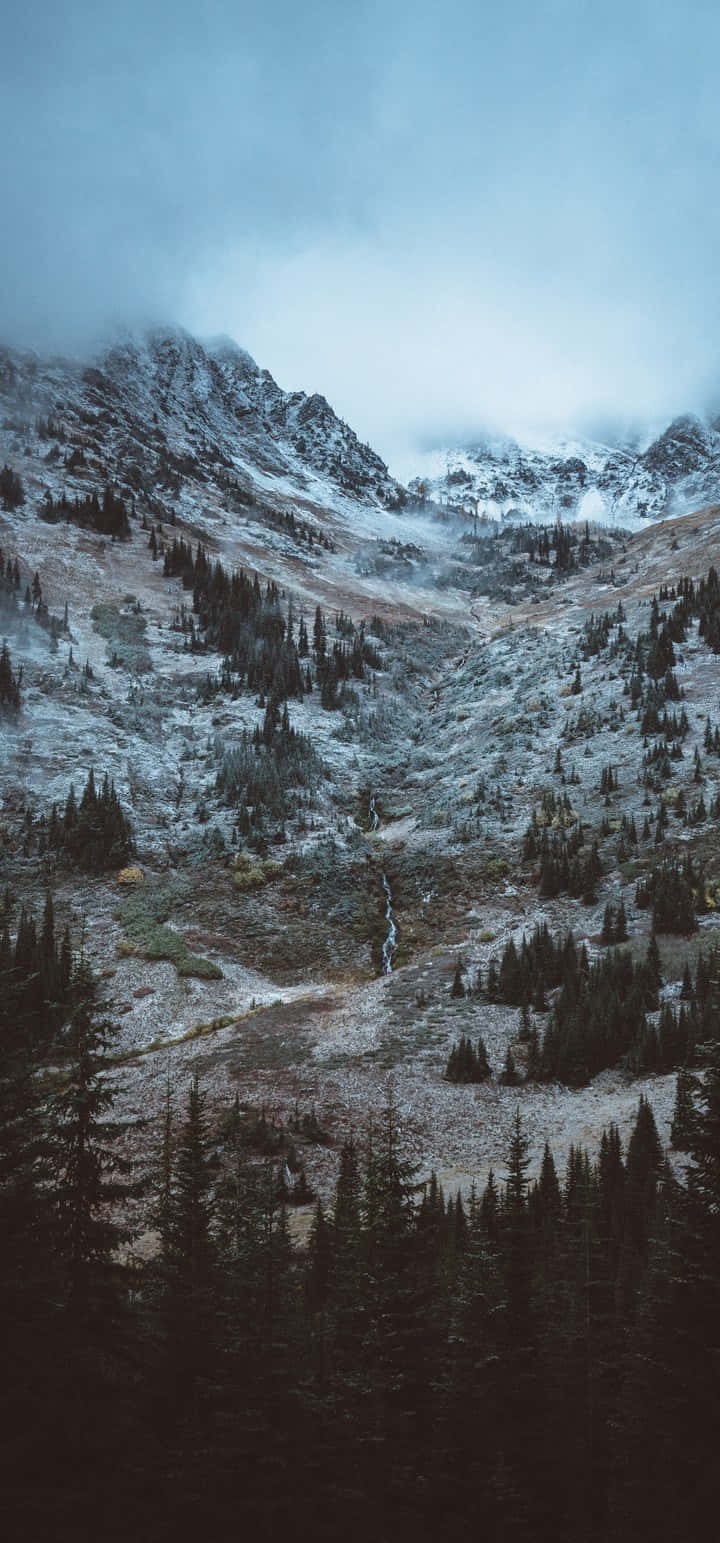 Glorious Top Of A Snow Mountain Background