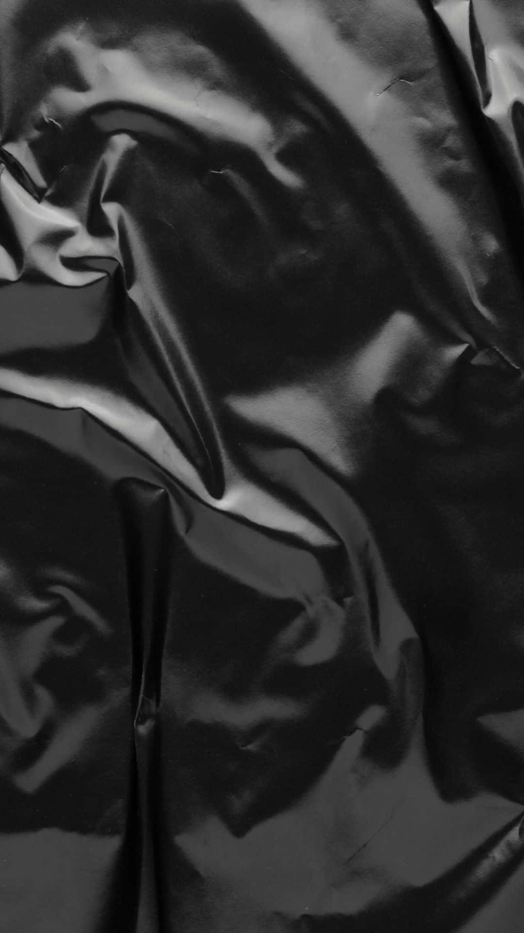 Glossy Black Surface Surrounded By Vibrant Colors. Background