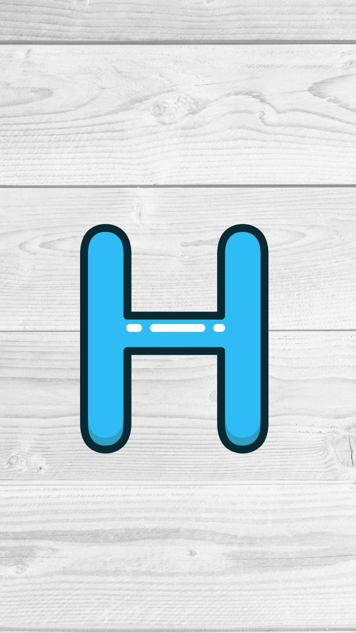 Glossy Letter H On Wood Background