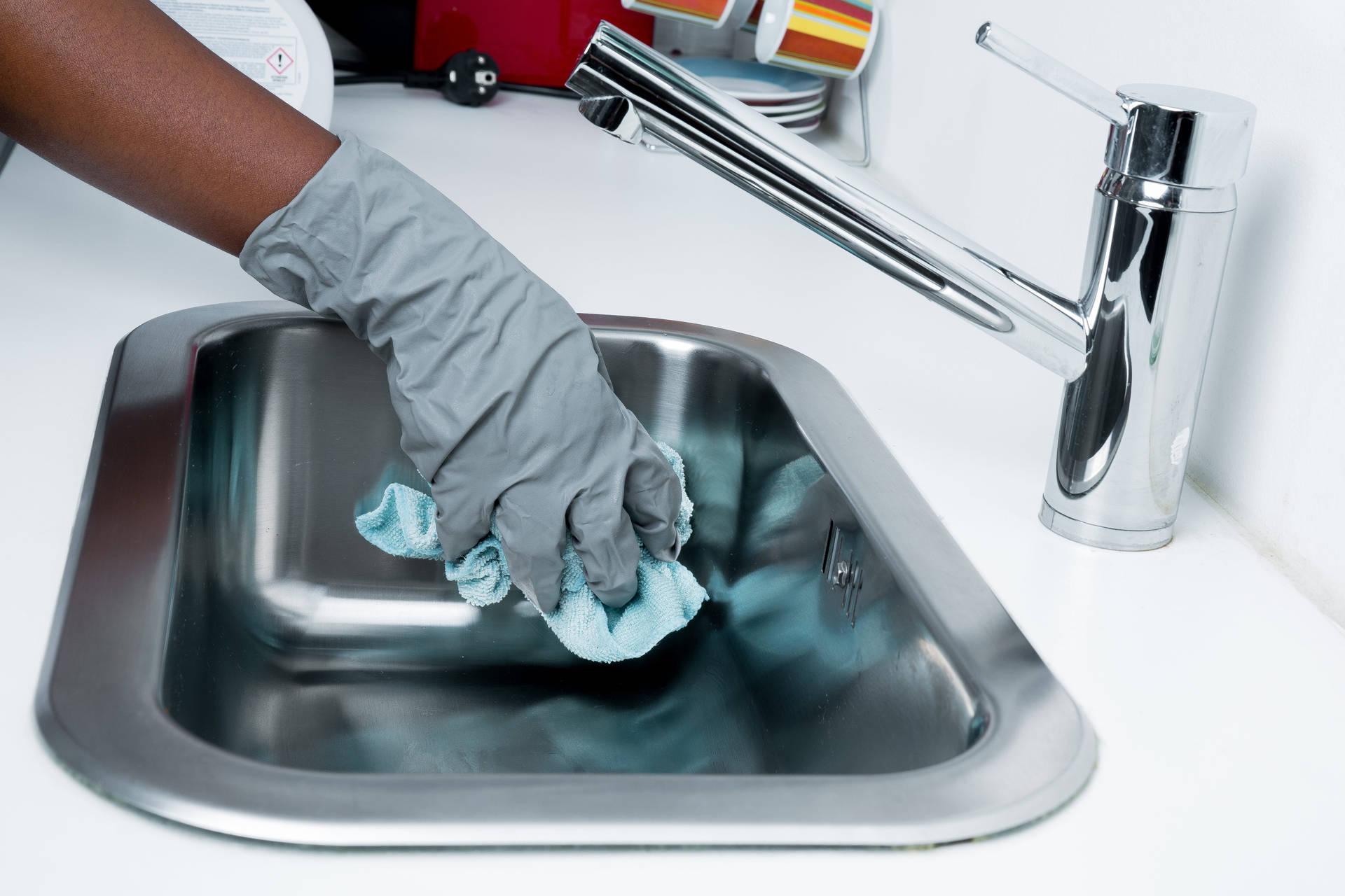 Gloved Hand Cleaning Sink House Cleaning Background