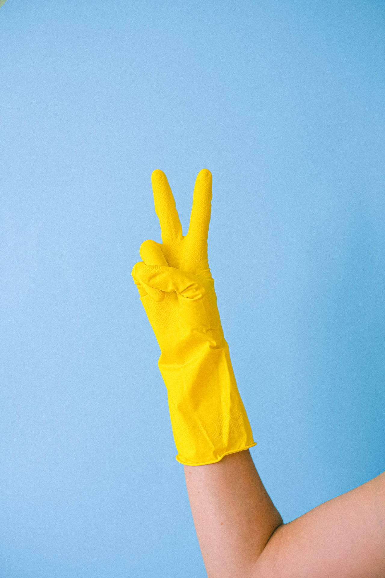 Gloved Hand Doing Peace Symbol Background