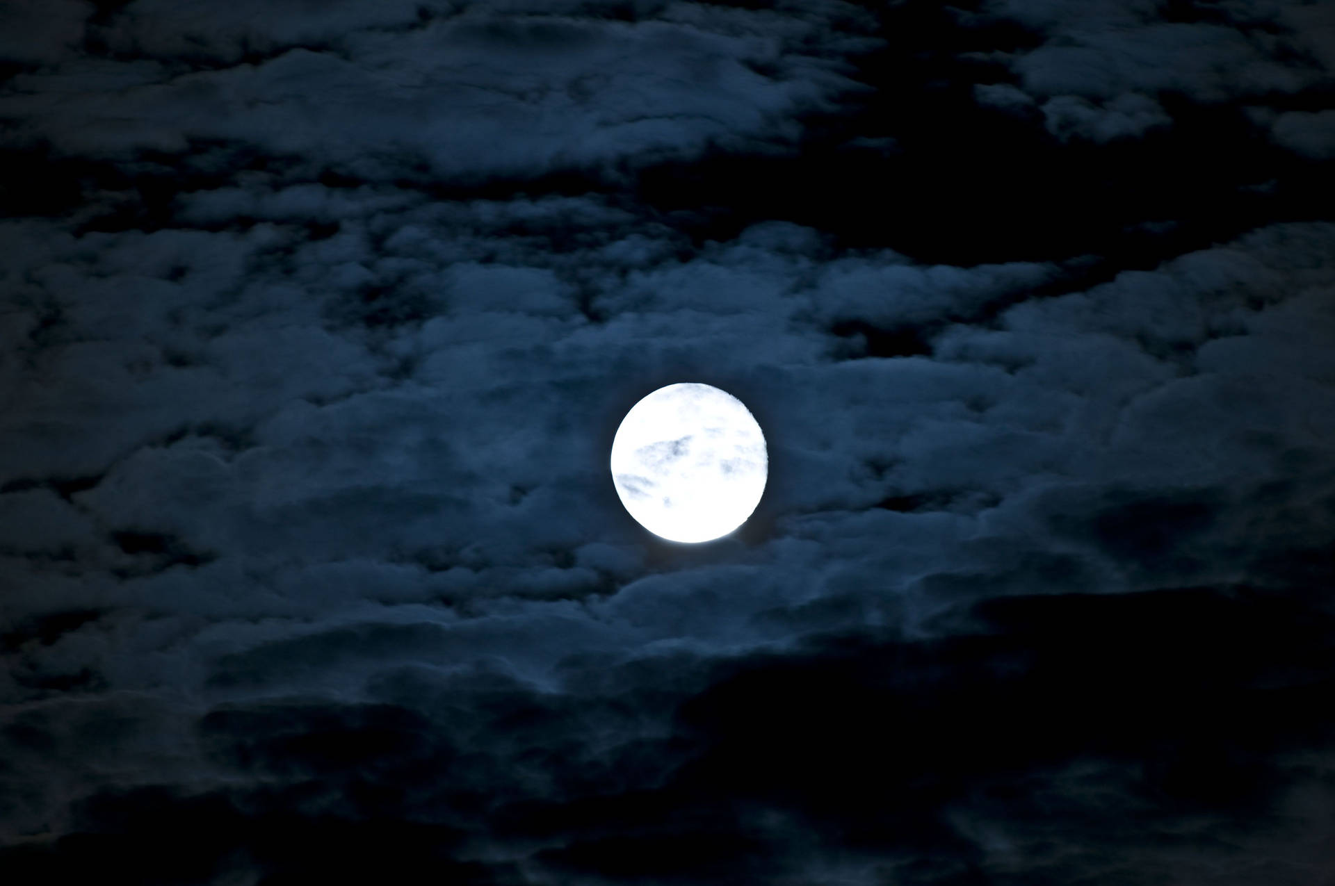 Glowing Beautiful Moon In The Dark Sky Background