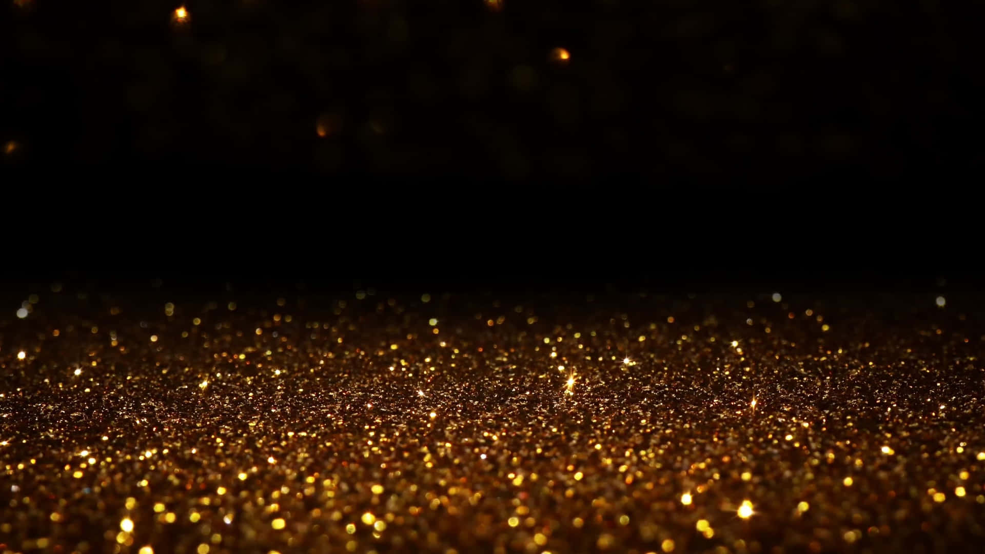 Glowing Black And Gold Glitter Particles Background