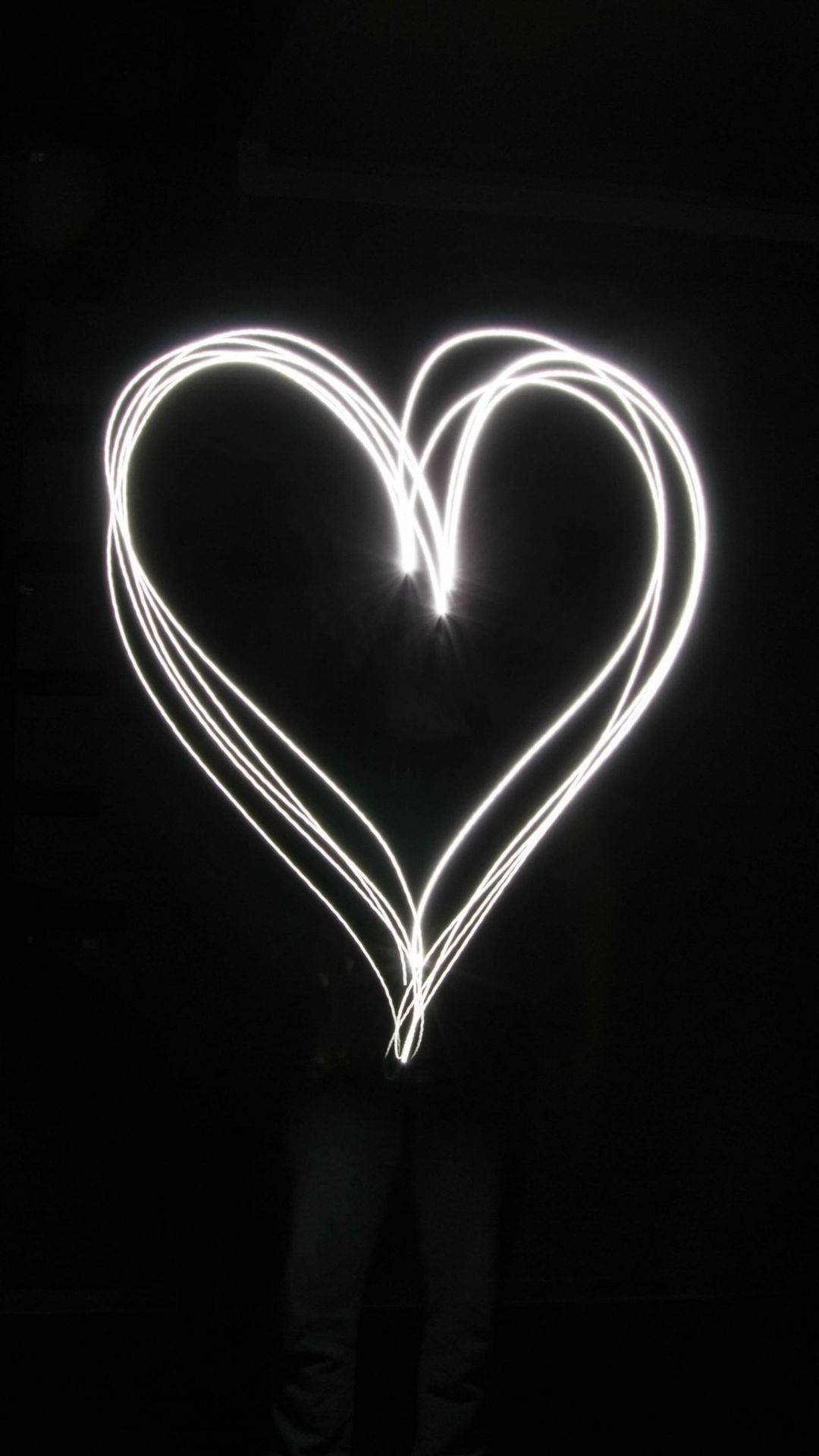 Glowing Black Heart On Black Background