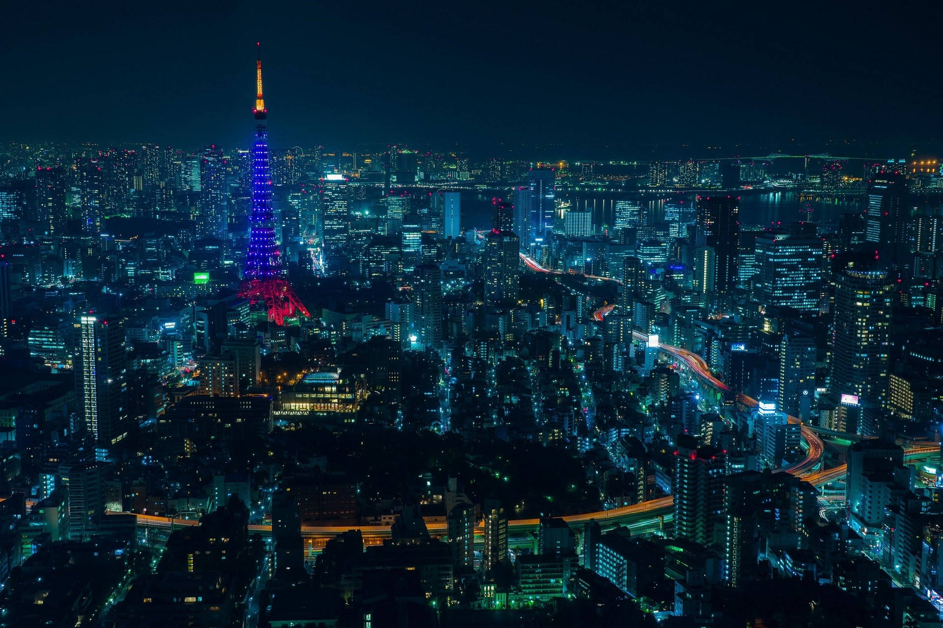 Glowing Blue Tower In Anime Night City Background