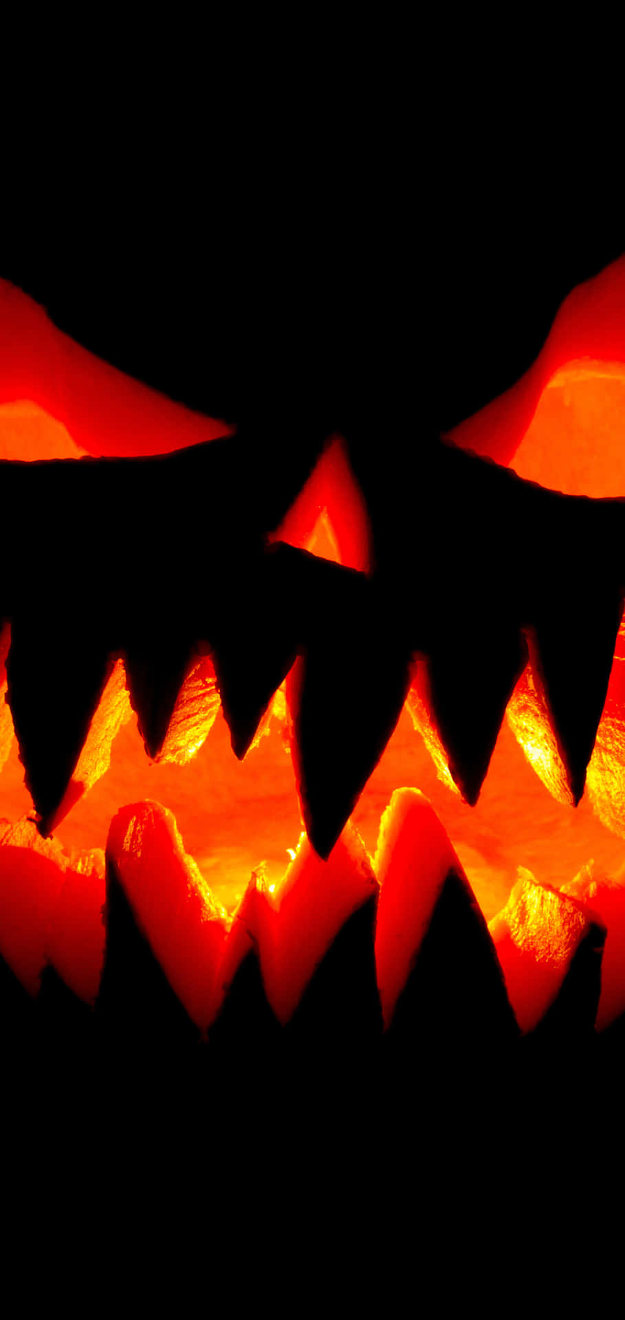 Glowing Halloween Pumpkin Face Background