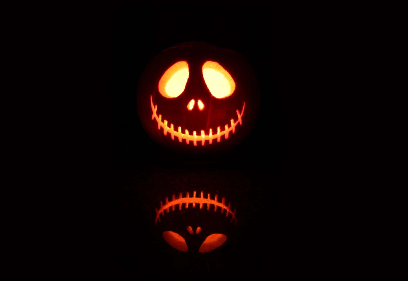 Glowing Jack O Lantern Reflection Background