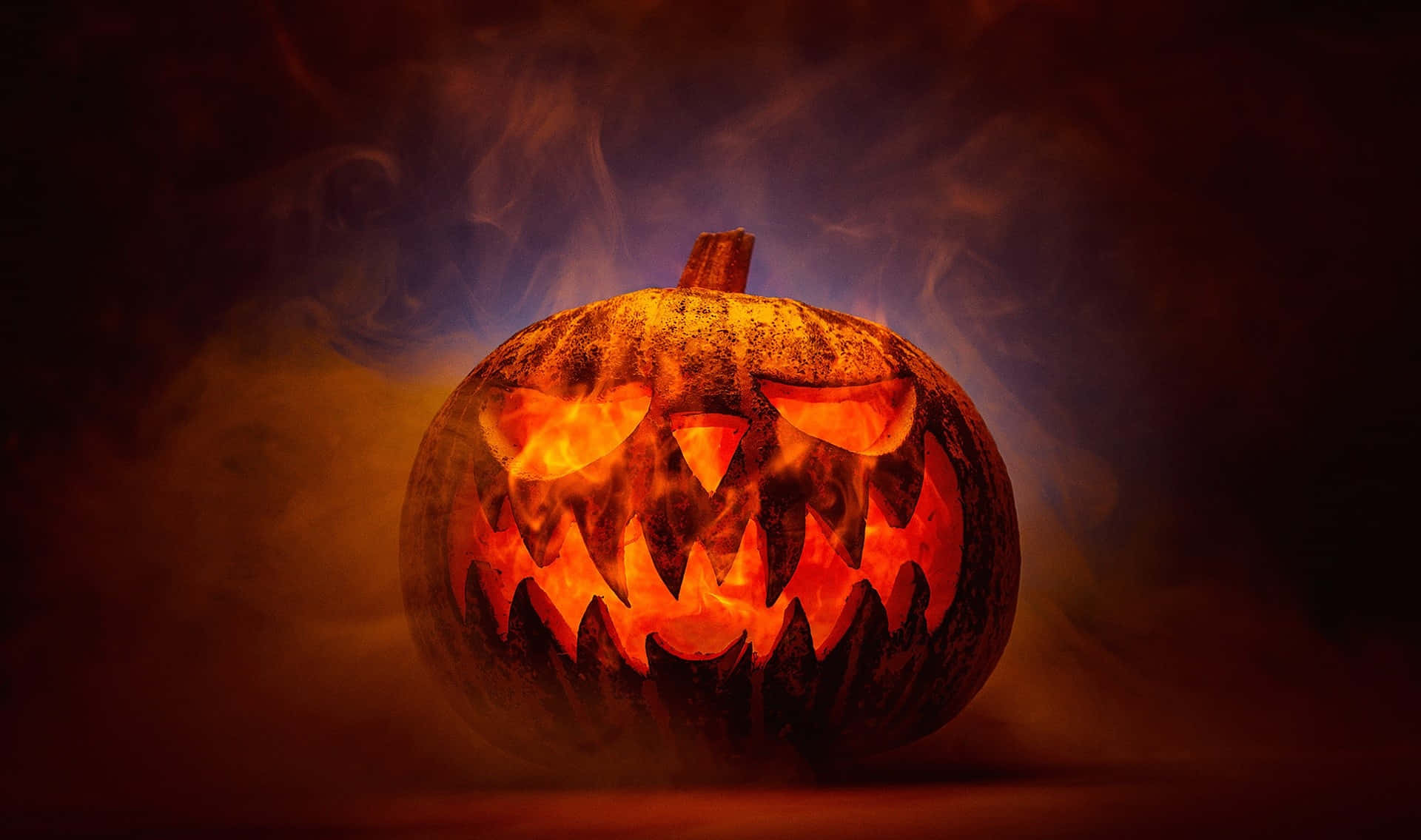 Glowing Jack O Lanternin Smoke Background