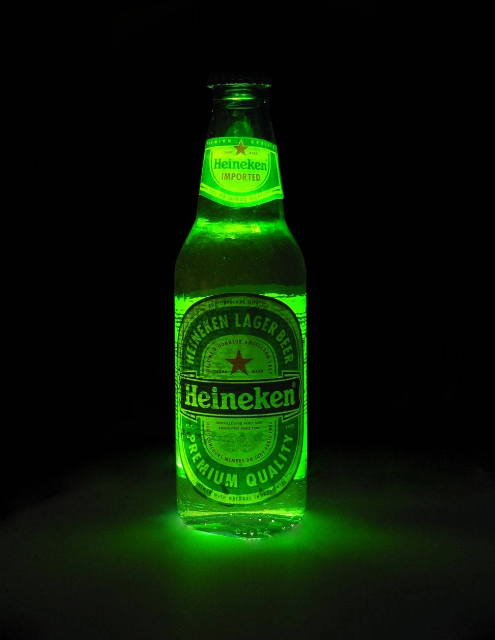 Glowing Neon Green Heineken Lager Beer Bottle Background