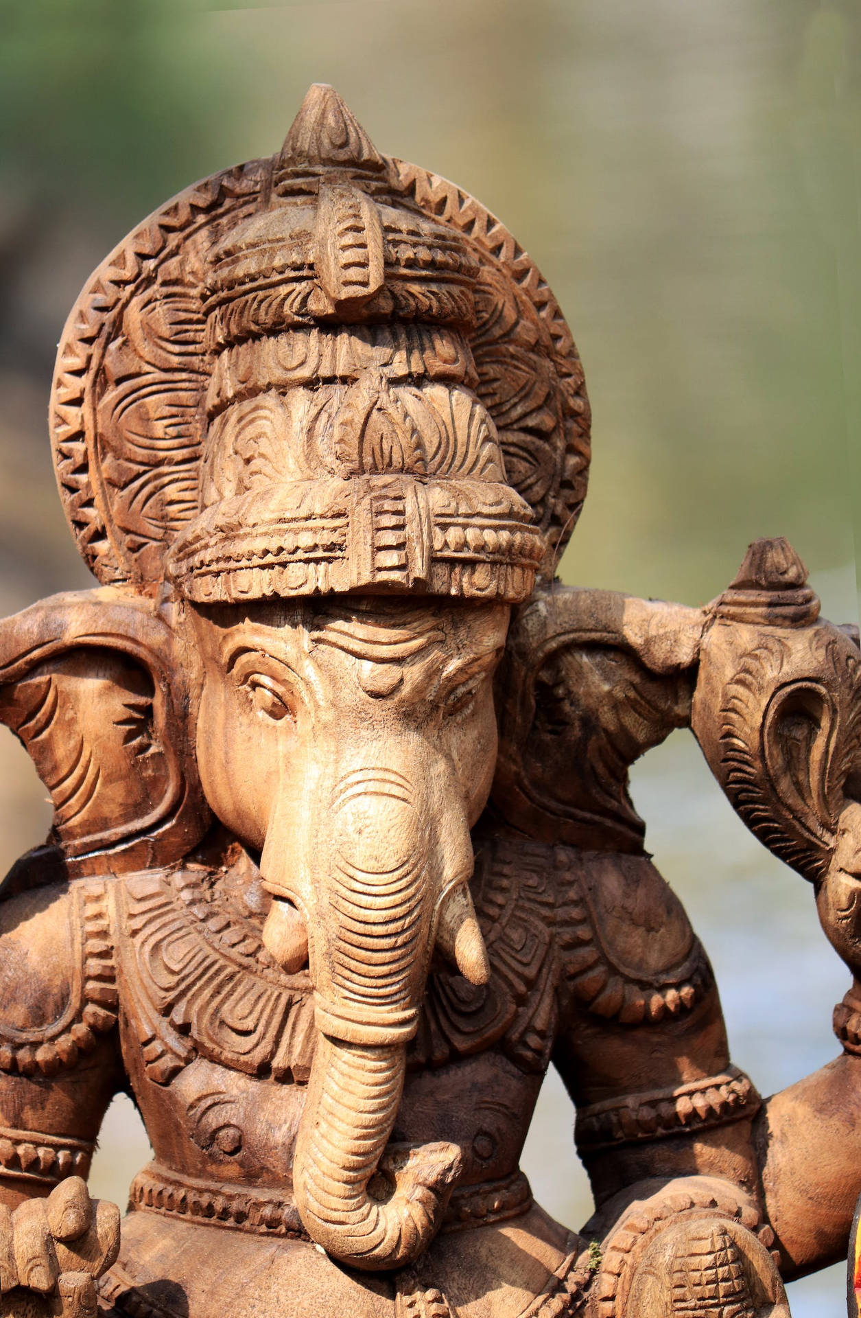 God Ganesh Wooden Statue Background