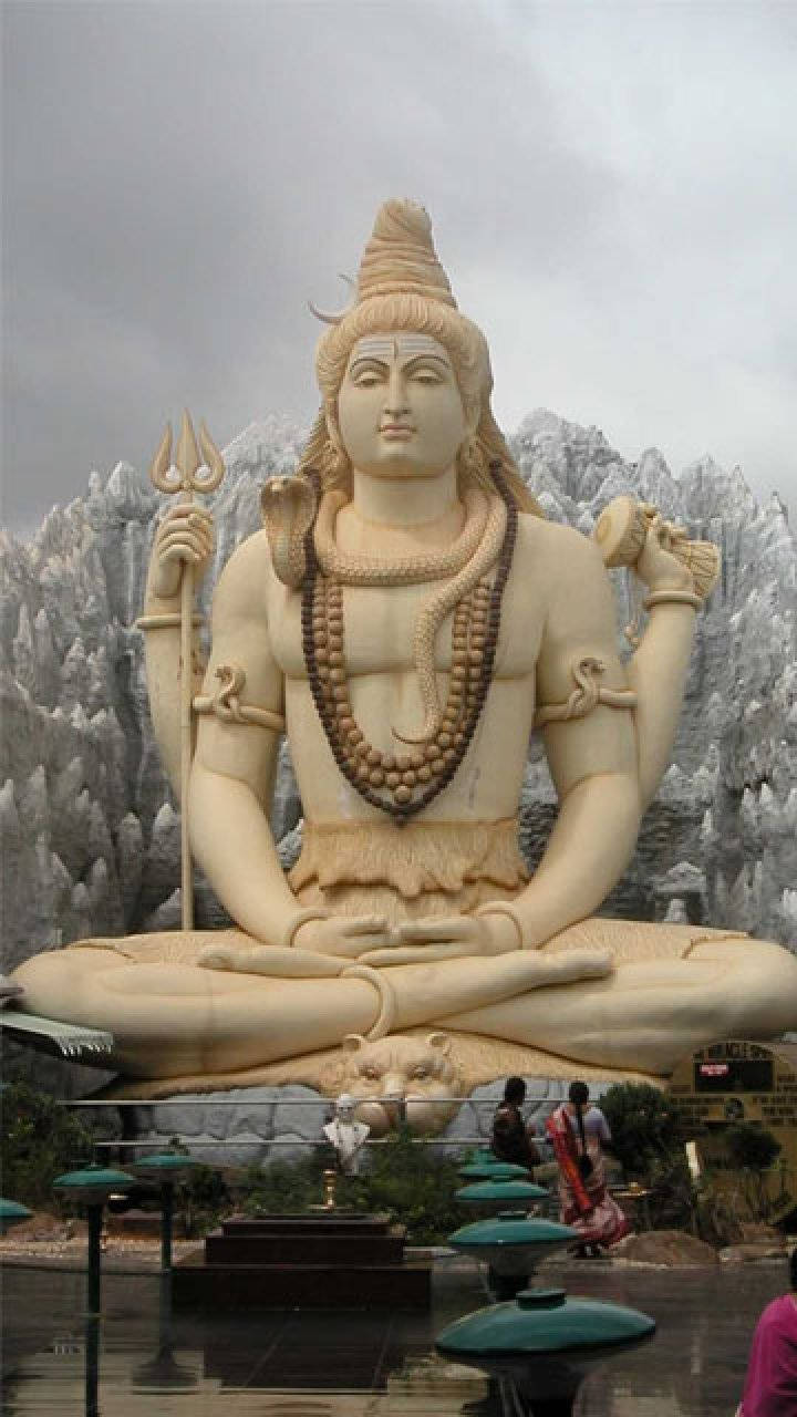 God Shiva Statue With Tourists Background